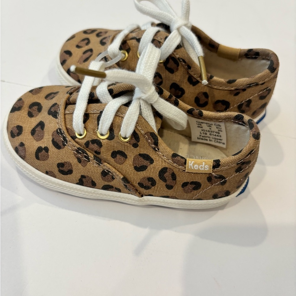 NWOT Keds leopard print infant size 4M tennis shoes. Excellent condition.